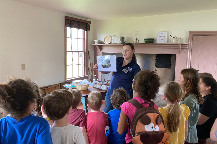 children watching a presenter talk