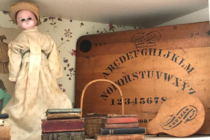 ouija board, old doll, old books