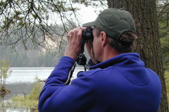 Person with binoculars