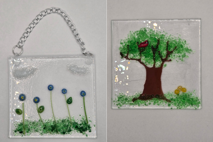 clear glass suncatchers with flowers, trees, grass and other nature elements