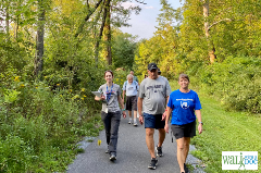 People walking along a paved path