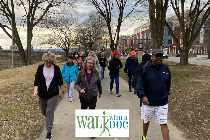 People walking along a paved path