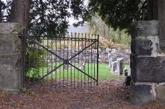 Open gate looking in the cemetery