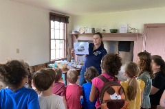 Educator teaching a group of kids