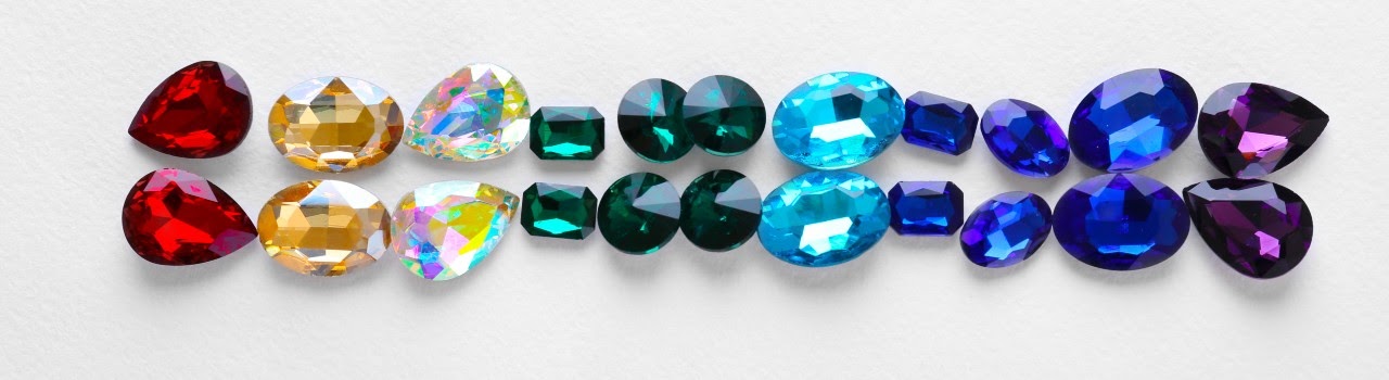 pairs of similar stones in colors red, yellow, clear, green, blue, and purple