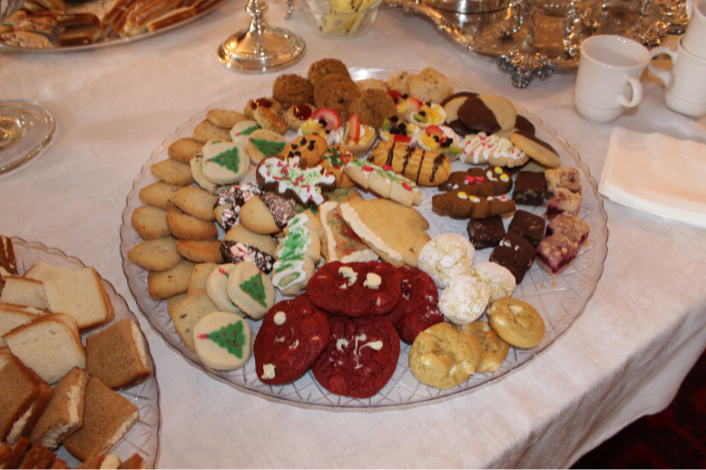 Holiday Cookies on a Dining Table with Tea Cups in the background