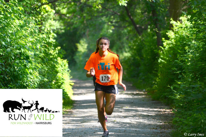 Person running an outdoor race on a trail