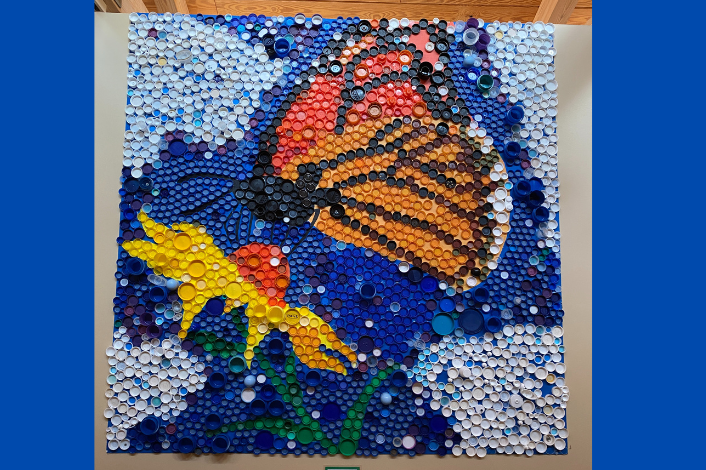 Art piece made of bottle caps to resemble a butterfly